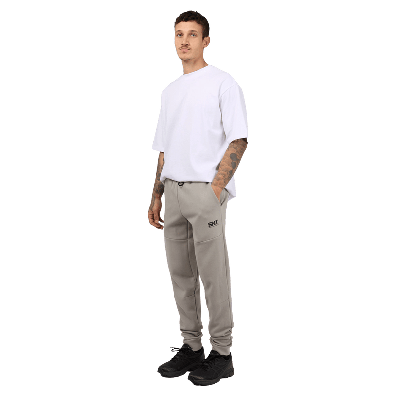 Full-body view of the St. Goliath Tech Track Pants in Grey colourway, men's model