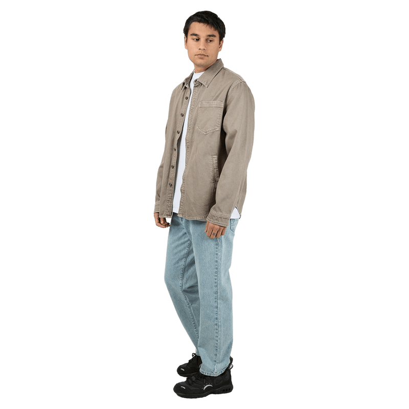 Full-body side  view of the St Goliath Moab LS Shirt in Mushroom colourway, men's model