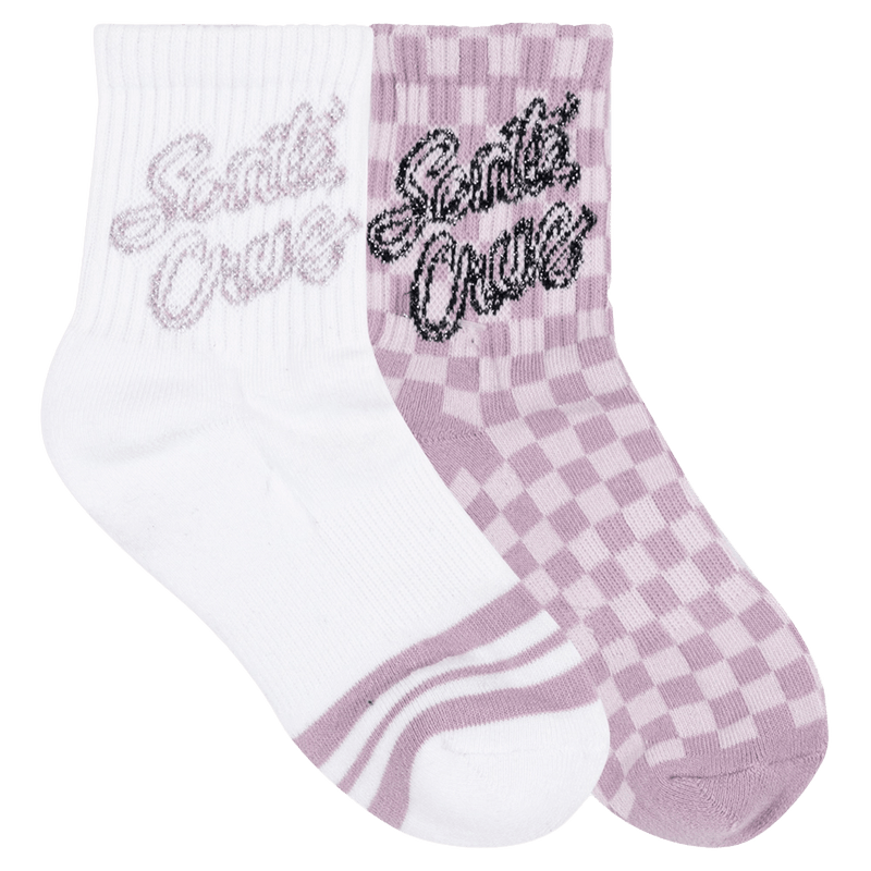 View of the Ribbon Script Checkboard Mid Sock 2 Pack for Kids from Satan Cruz. Featuring a folded pink and white check sock and a white sock with pink stripe detail at the toe, and Santa Cruz branding on the cuff of each in contrast tone.