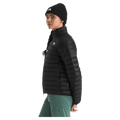 View of a woman wearing The North Face Terra Peak Jacket for Women in Black featuring a full front two-way zip with internal draft flap, zip side pockets, and a heat transfer white logo on the left chest