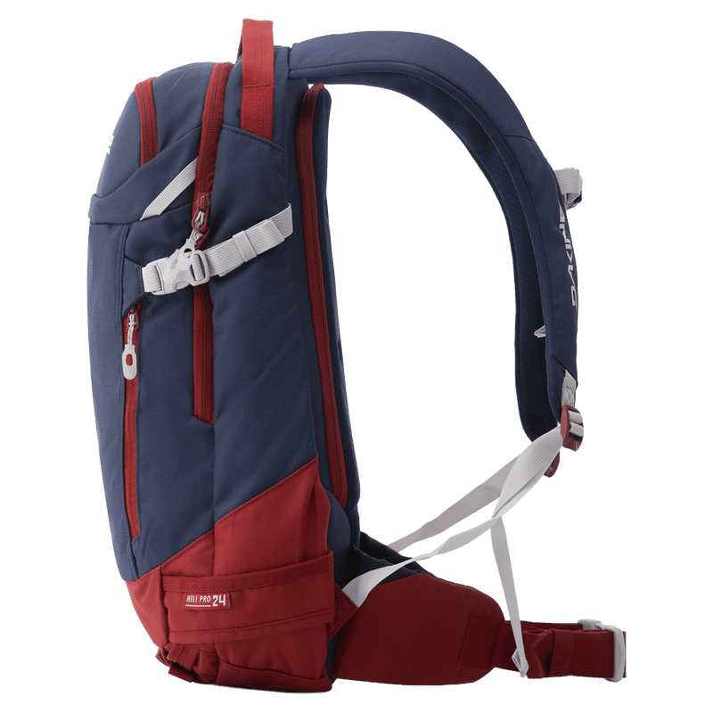 Side view of the Dakine Heli Pro 24L Backpack in NAVAL ACADEMY colourway, unisex's model