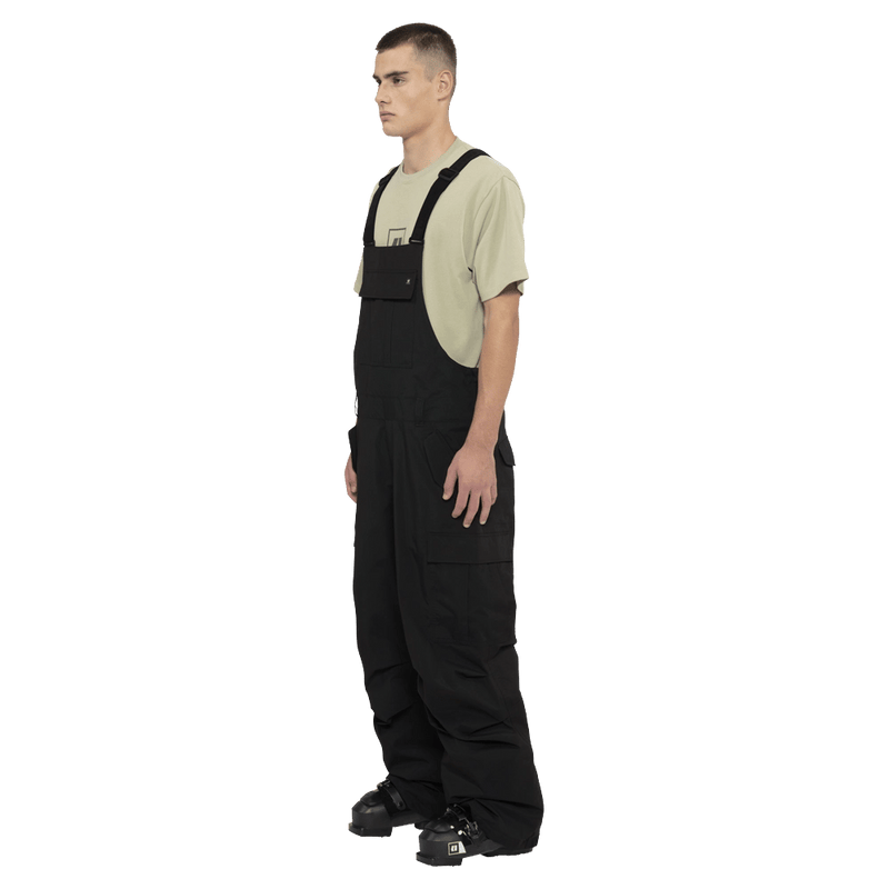 Side view of the Armada Sumpter 2L Bib in Black colourway, men's model