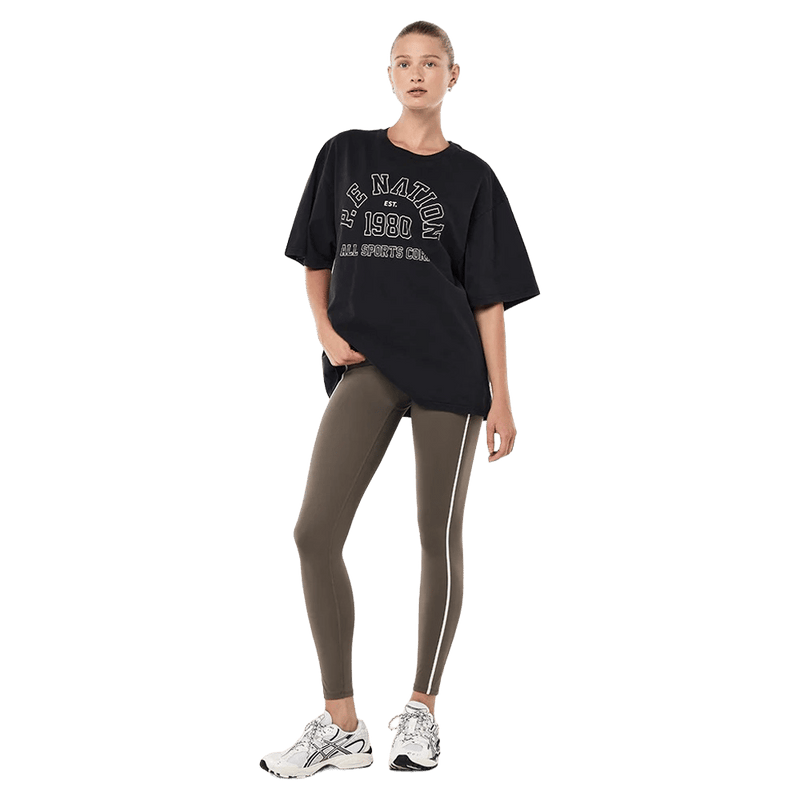 Full view of the PE NATION Altitude Tee Washed Black Tee,  26/27 Womens's model