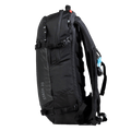 Side view of the Stash 20L Backpack from BCA in Black, featuring a top carry handle, adjustable buckles at the upper and lower sections, and adjustable padded dual zippered shoulder straps with hydration channel.