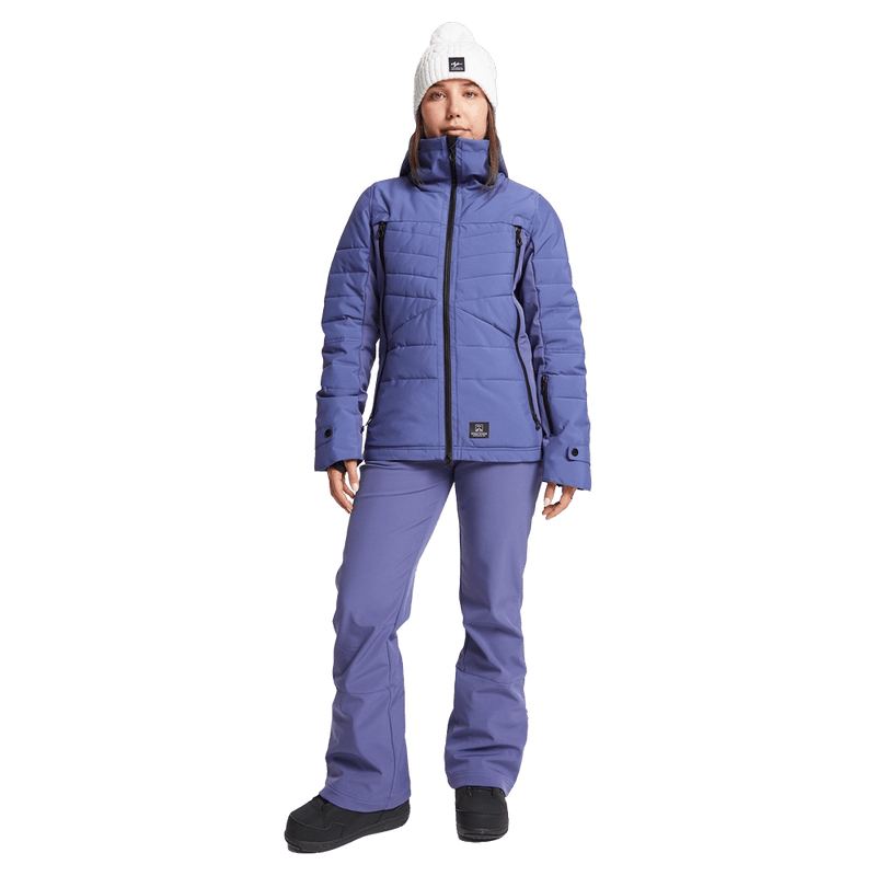 Front view of women wearing theRojo Softshell High Rise Ski Pants - Womens in colour Skipper Blue