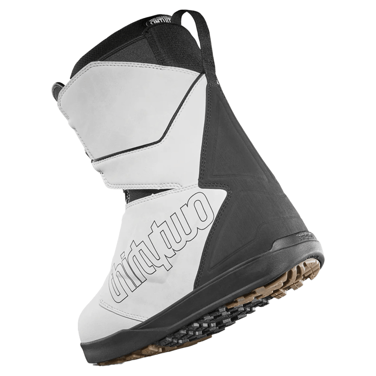 White and black Thirtytwo Lashed Double BOA snowboard boot showing side profile, branding, and textured rubber sole.