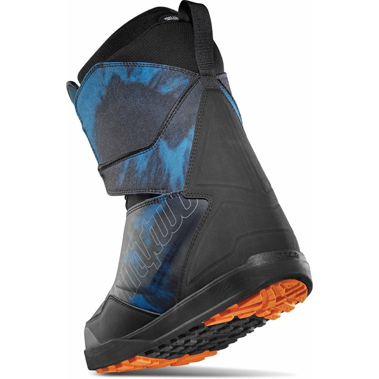 Thirtytwo Lashed Double BOA snowboard boot in black and blue tie-dye with a bright orange outsole, rear side view.