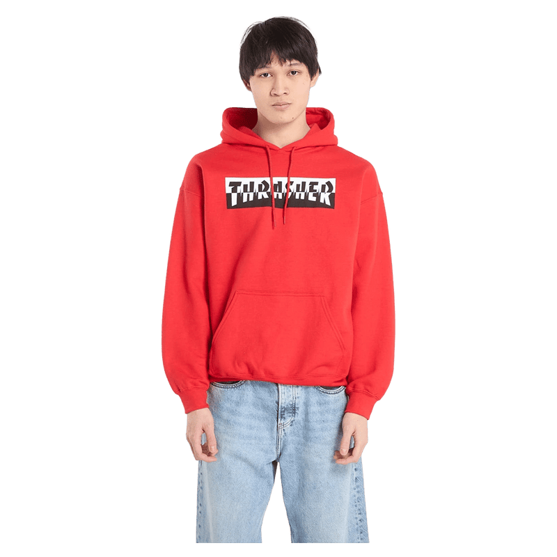 Red Thrasher Mixtape Hoodie with a distorted black and white logo, front pocket, and hood, worn with light blue jeans.