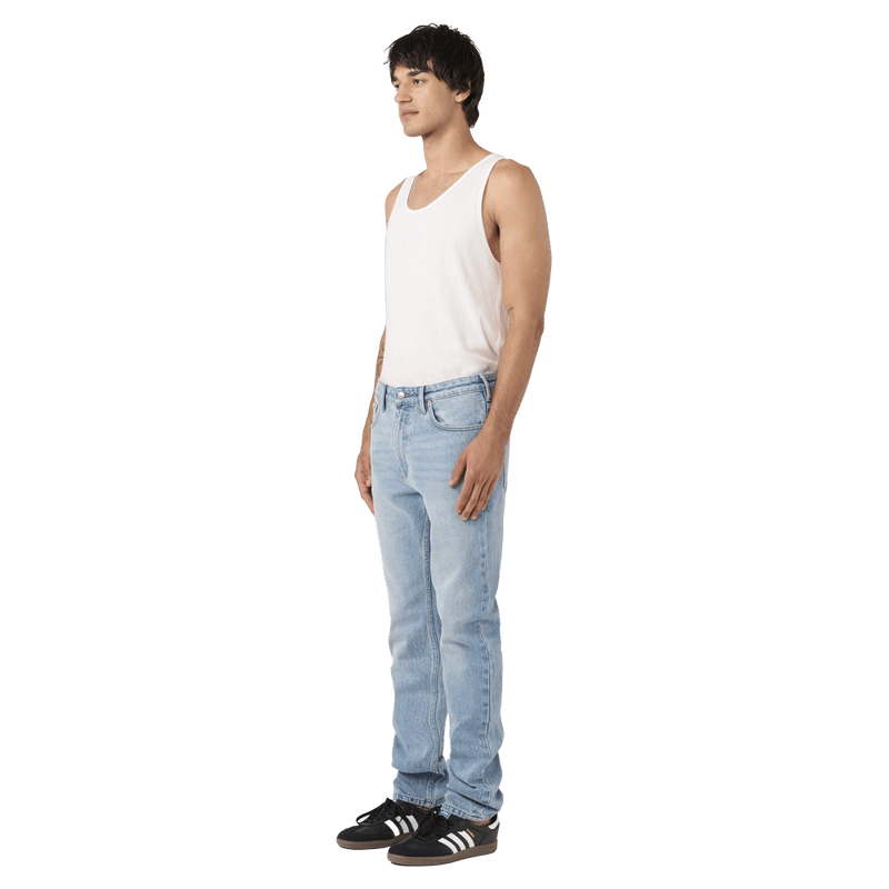 Side view of man in the Rollas Tim Slims Bad Boy Boogie Jeans in colour Mid Blue