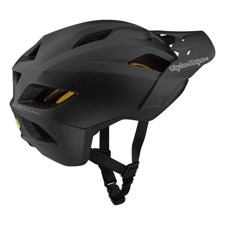 Matte black Troy Lee Designs Flowline Mips kids mountain bike helmet with air vents, visor, and yellow MIPS liner.
