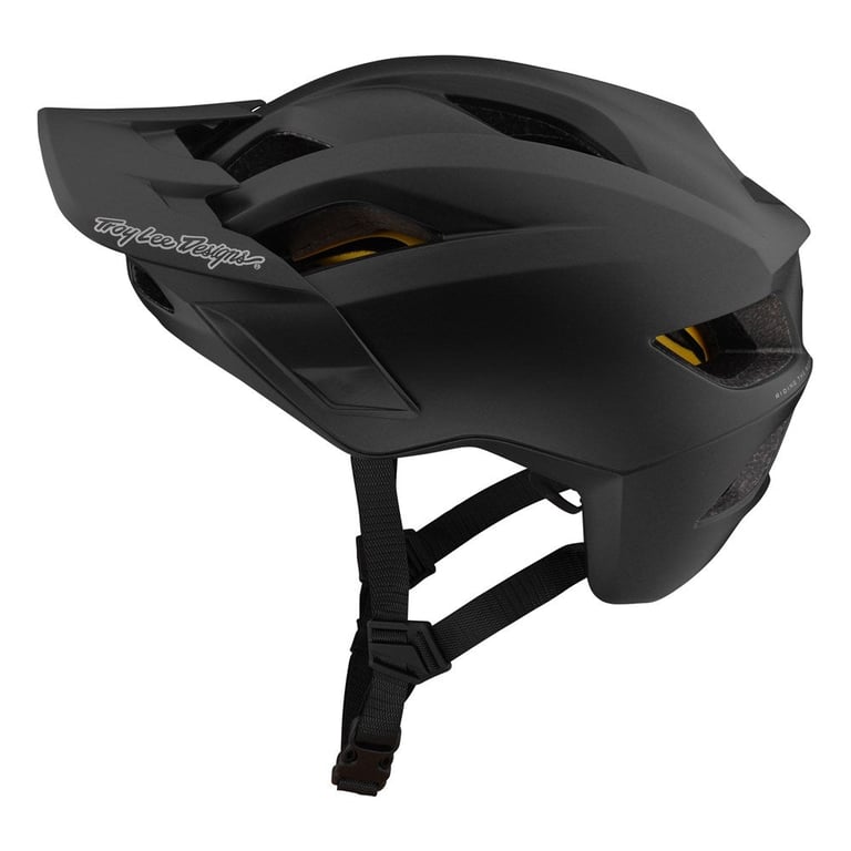 Matte black TLD Flowline Mips kids mountain bike helmet with visor and side vents, shown from a side profile.