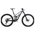2023 Trek Fuel EX 8 Gen 6 mountain bike with a grey to black gradient frame, full suspension, and knobby tires.