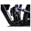 2023 Trek Fuel EX 8 Gen 6 mountain bike with a grey to black gradient frame, full suspension, and knobby tires.
